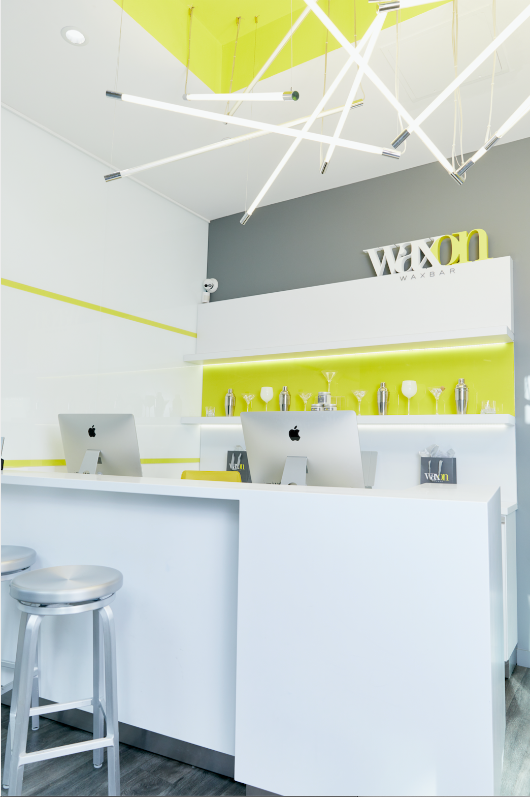 Interior photo of a WAXON Laser + Waxbar. The image is of the reception desk area where guests book hair removal services.