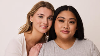 Two women facing the camera, the woman on the left is leaning on the other, both have freshly waxed, shaped, laminated, tinted brows.