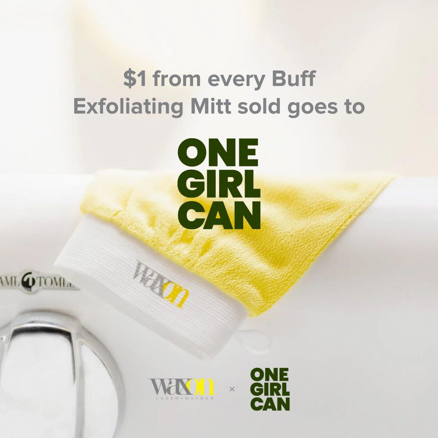 Yellow exfoliating mitt draped over a bath tub with a note that says "$1 from every Buff Exfoliating Mitt sold goes to One Girl Can" - a charity to help girls living in extreme poverty.