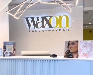 Front reception desk for WAXON Laser + Waxbar in Lansdowne Live, Ottawa.