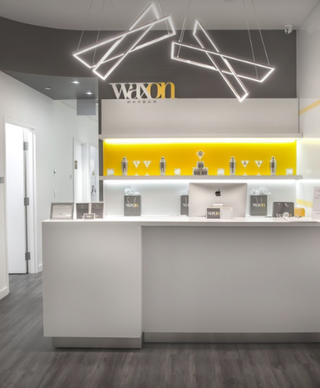 WAXON Laser + Waxbar guest services desk at Commerce Court in Toronto.