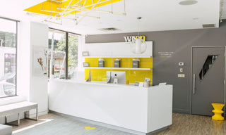 Waxon interior image of the Summerhill location showing the front desk with plenty of natural light