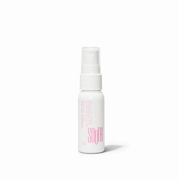 Small bottle of SOUTH Deomist, white bottle and pink font. Deomist is Ph Balanced.