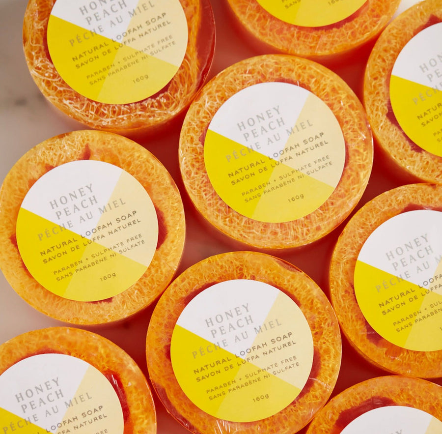 Multiple round Honey Peach loofa soaps shot from above
