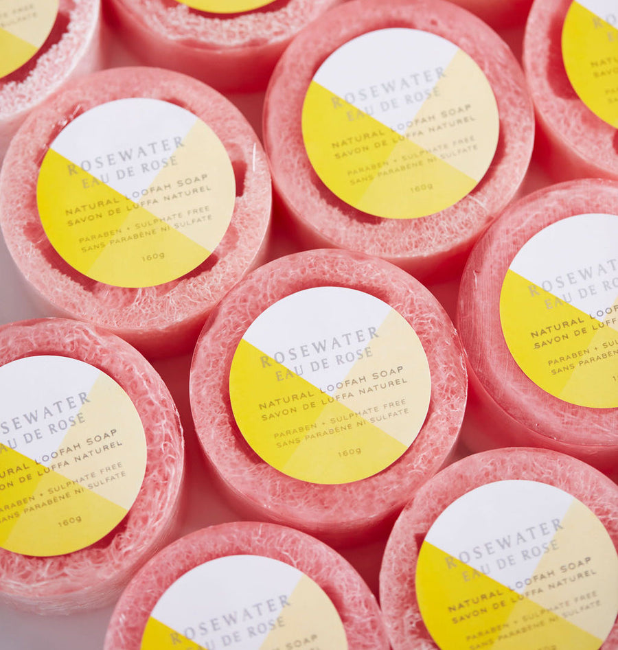 Multiple round rosewater loofa soaps shot from above